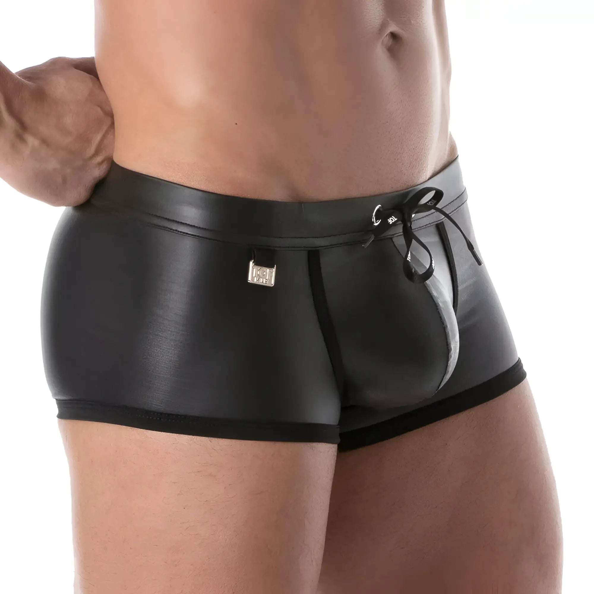 Black patent leather fetish swim trunks with sleek glossy finish and black drawstring waistband