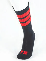 Black athletic tube sock with bold red stripes and matching fk logo on the toe for sports use