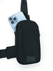 Black fk sport cross body bag in black with sleek minimalist design and durable fabric for everyday use