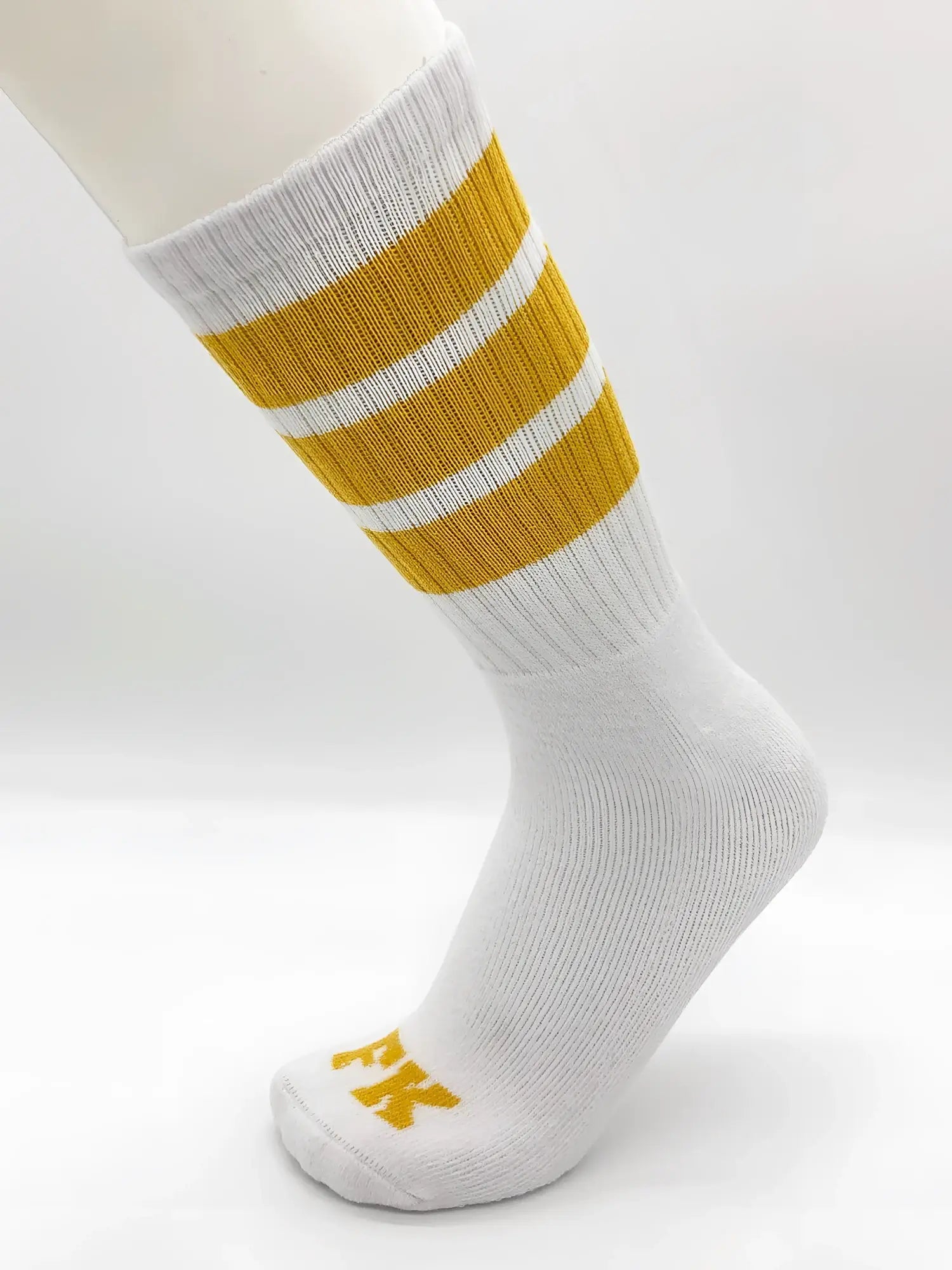 Fk sport white tube sock with three mustard-yellow stripes and small yellow logo on the toe for athletic use