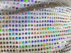 Flat sequin hooded crop top in shimmering silver fabric with iridescent multicolored sequins in a grid pattern