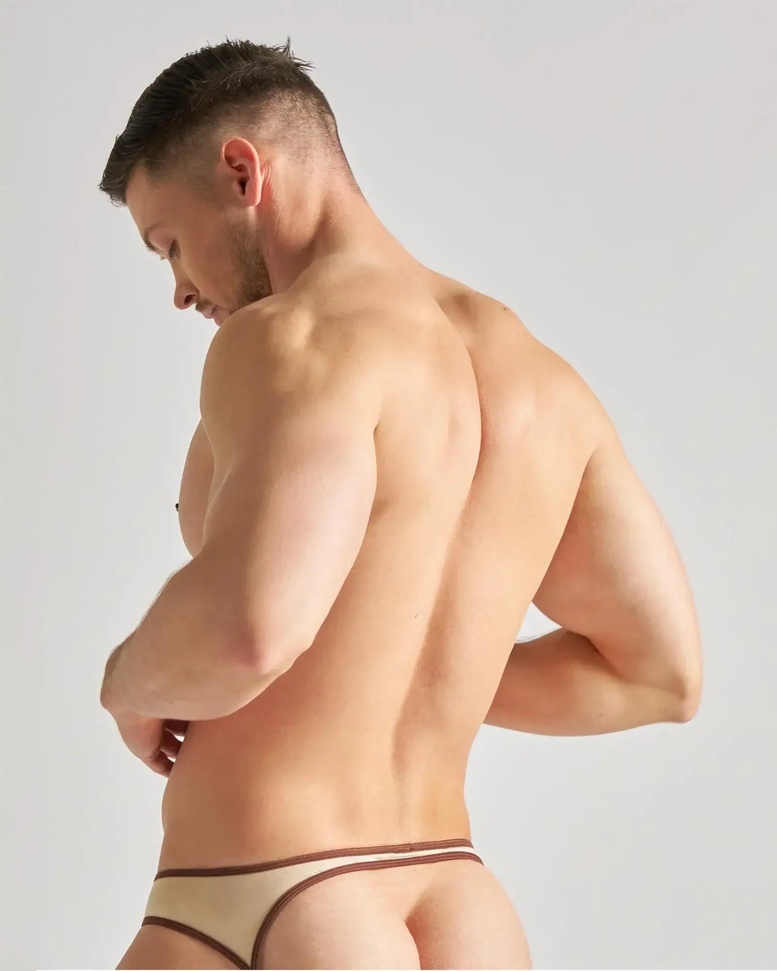 Beige flaunt jockstrap with brown trim showing the back side for comfortable and stylish support