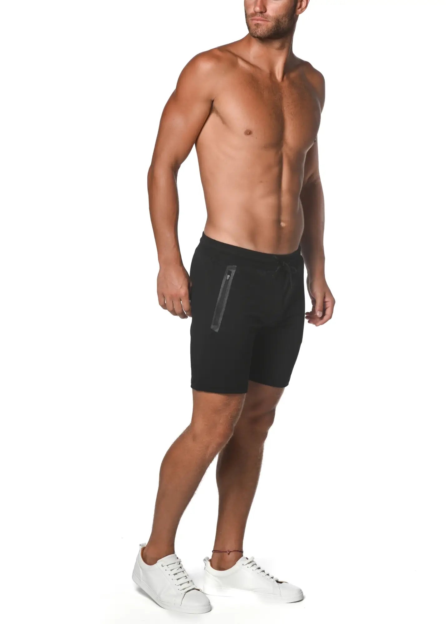 Black fleece flex-cotton stretch shorts with sleek modern design and subtle vertical zipper detail on the side