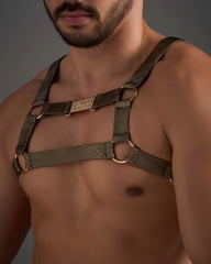 Dark green snakeskin-textured leather flex harness with gold-tone metal rings and a central plaque
