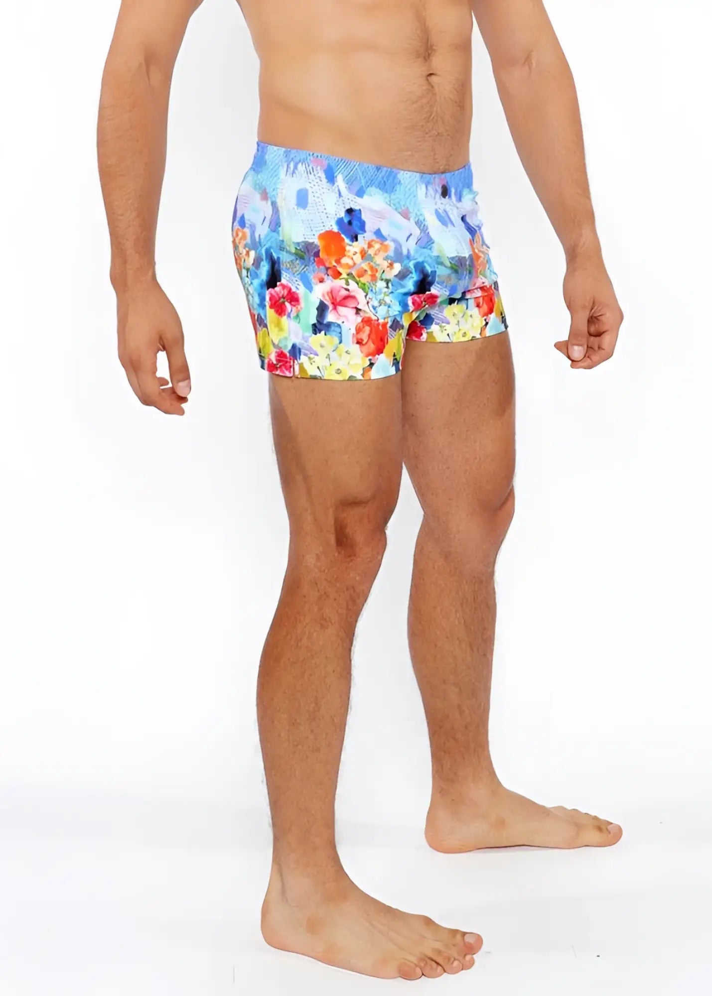 Floral abstract printed swim short featuring vibrant red orange yellow and blue floral patterned swim trunks