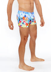 Floral abstract printed swim short featuring vibrant red orange yellow and blue floral patterned swim trunks