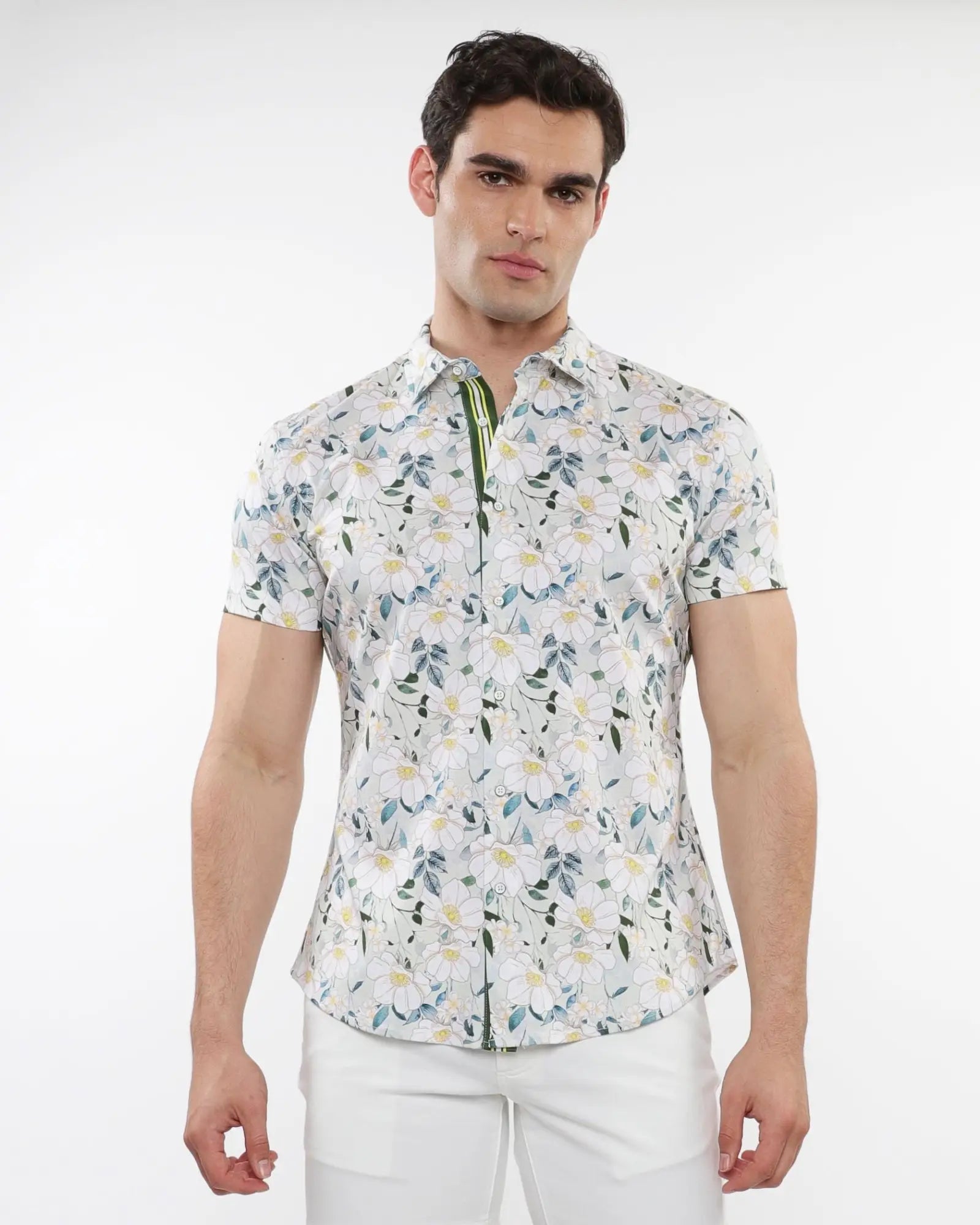 White short-sleeved stretch knit shirt with a delicate green blue and yellow floral print pattern
