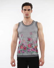 A men’s sleeveless mesh tank top with black and white polka dots and vibrant pink red purple roses and stripe ribbing