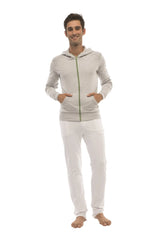 A heather gray form-fit crossover yoga track performance hoodie with green zipper and hood worn by a model