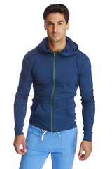 Navy blue form-fit crossover yoga track performance hoodie with lime green zipper and white drawstring waistband