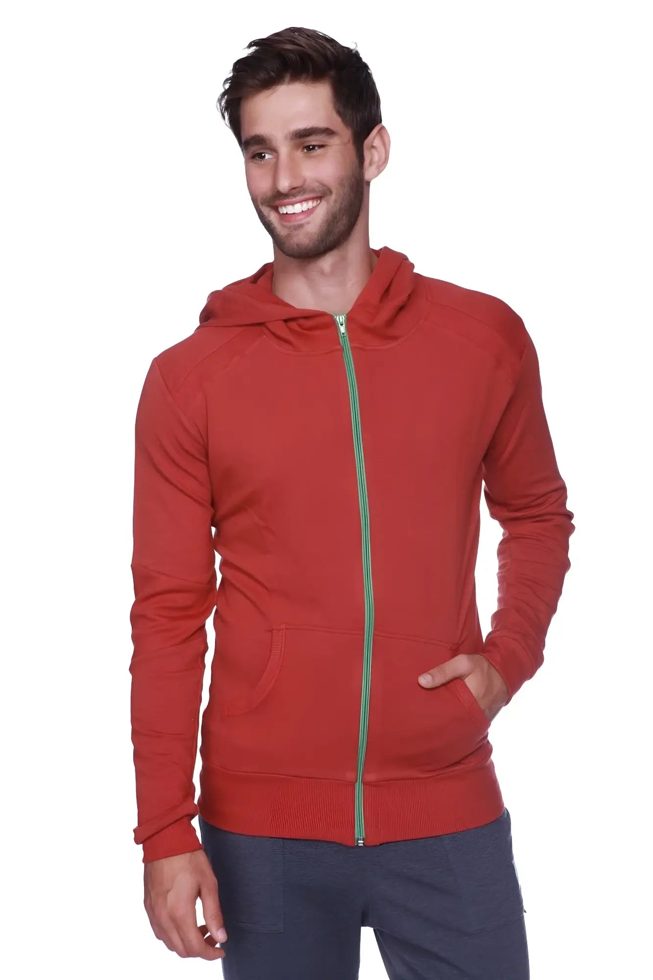 Form-fit crossover yoga track performance hoodie in solid cinnabar red with green zipper and front pockets