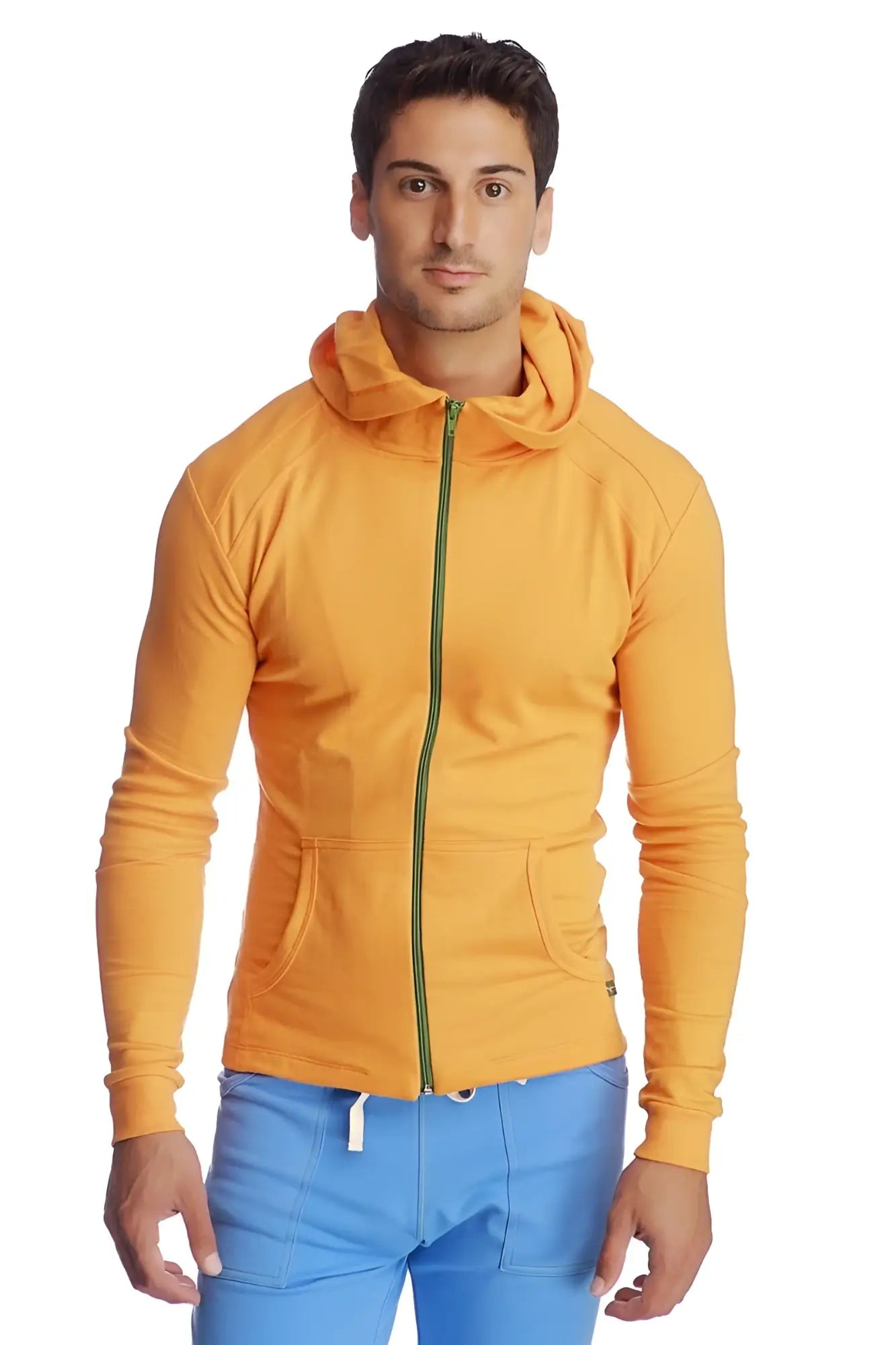 Form-fit crossover yoga track performance hoodie in sun orange with green zipper and two front pockets for activewear