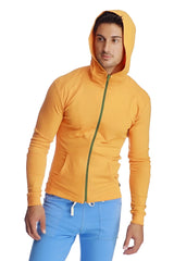 A vibrant yellow form-fit crossover yoga track performance hoodie with green zipper trim and matching hood