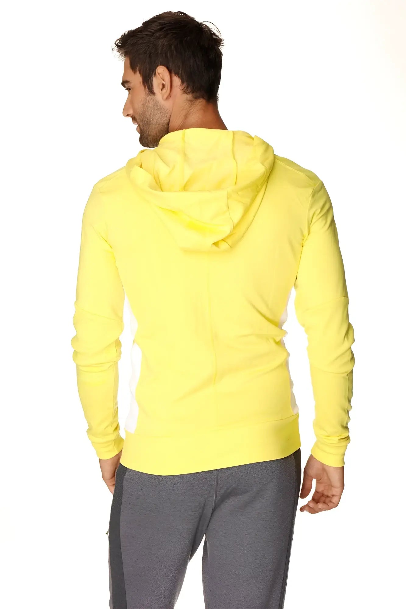 Bright yellow long sleeve form-fit crossover yoga track performance hoodie with ribbed hem in tropic yellow with white