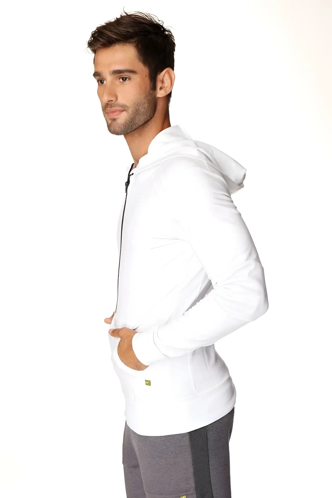 Form-fit crossover yoga track performance hoodie in white with black zipper and subtle green logo on lower left side