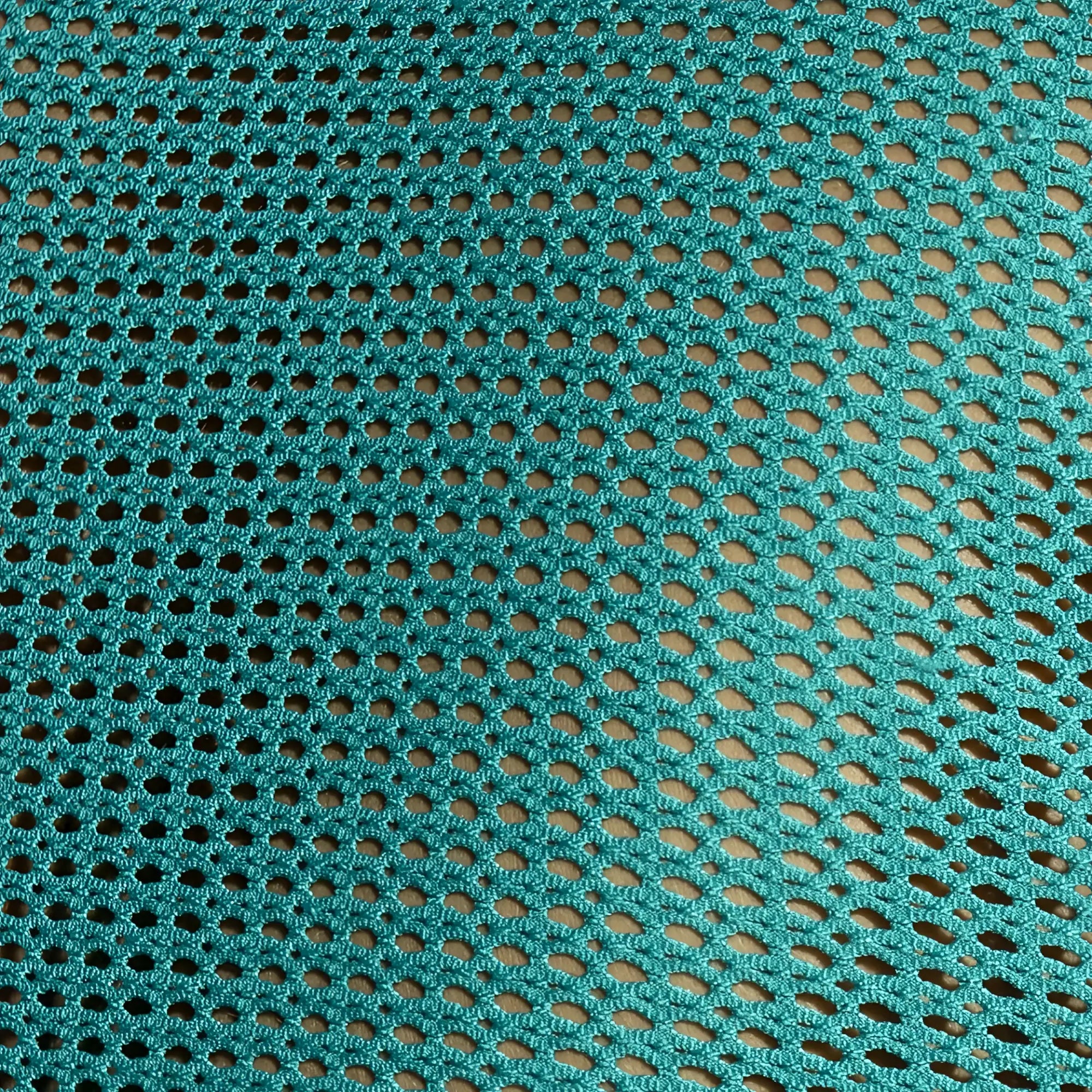 Teal crocheted mesh fabric with oval holes detail of formentera retro tank top material and pattern