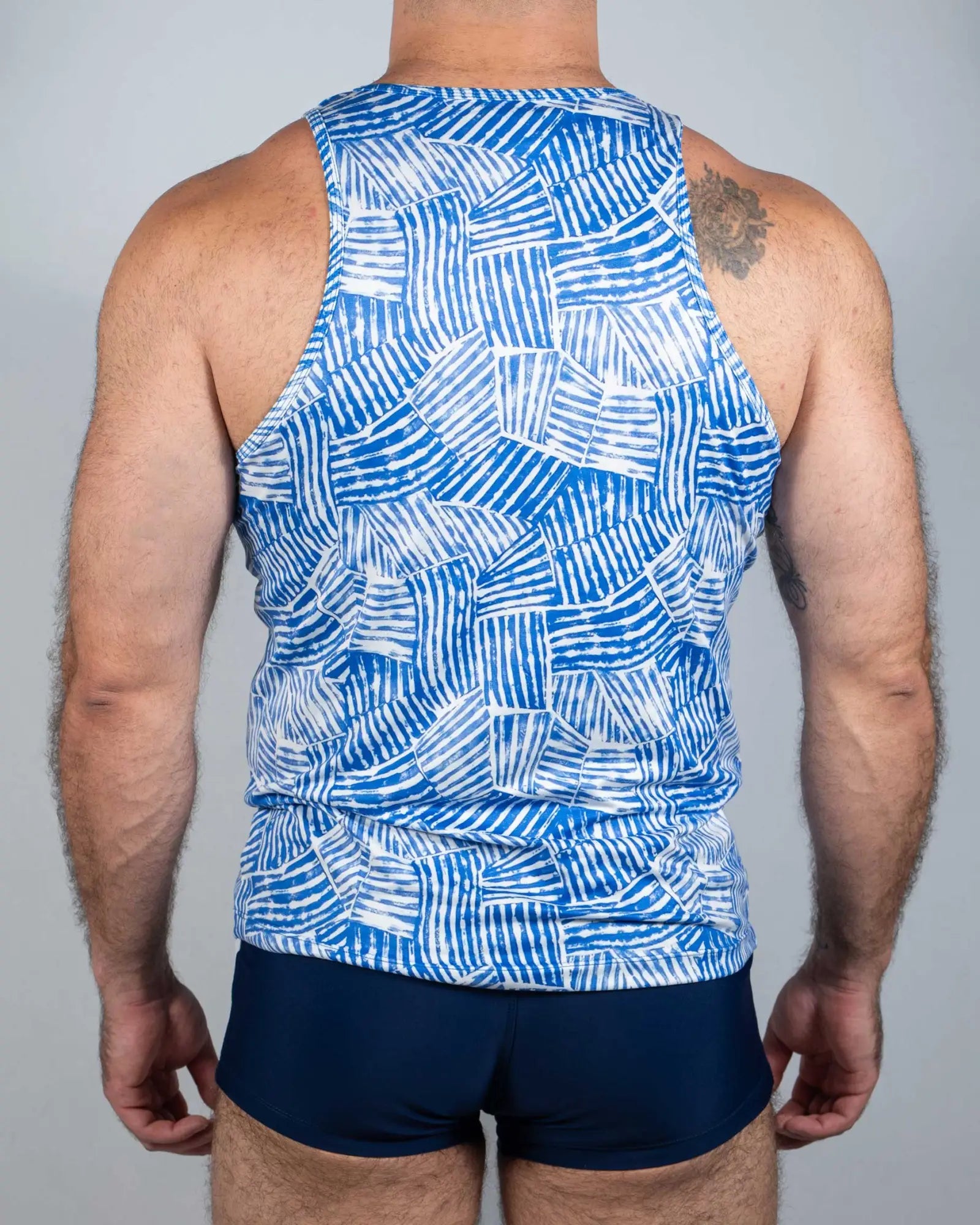 Blue and white geometric patterned tank top with a modern abstract design in breathable fabric fun square print tank
