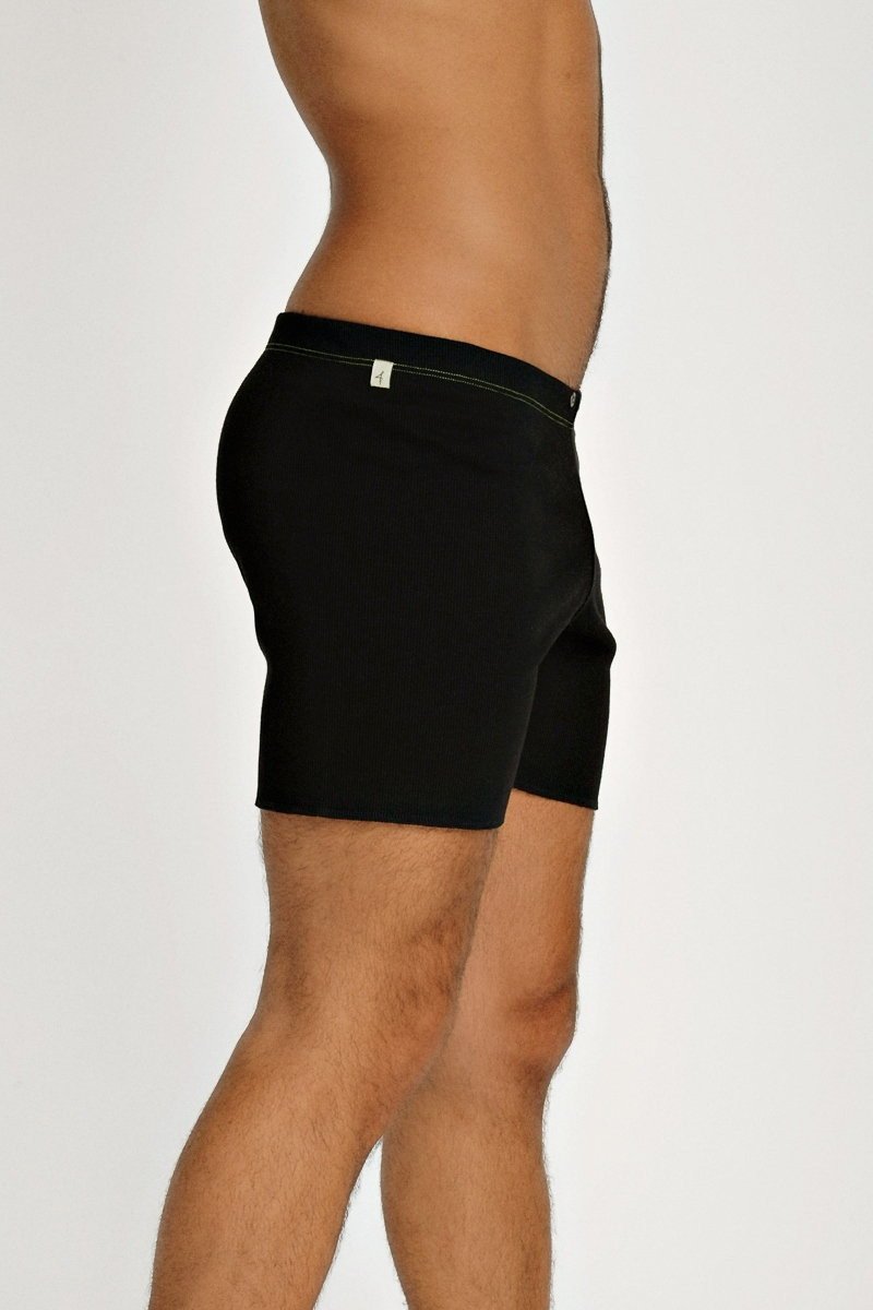 Black fusion yoga short briefs with subtle white logo on waistband designed for comfortable active wear