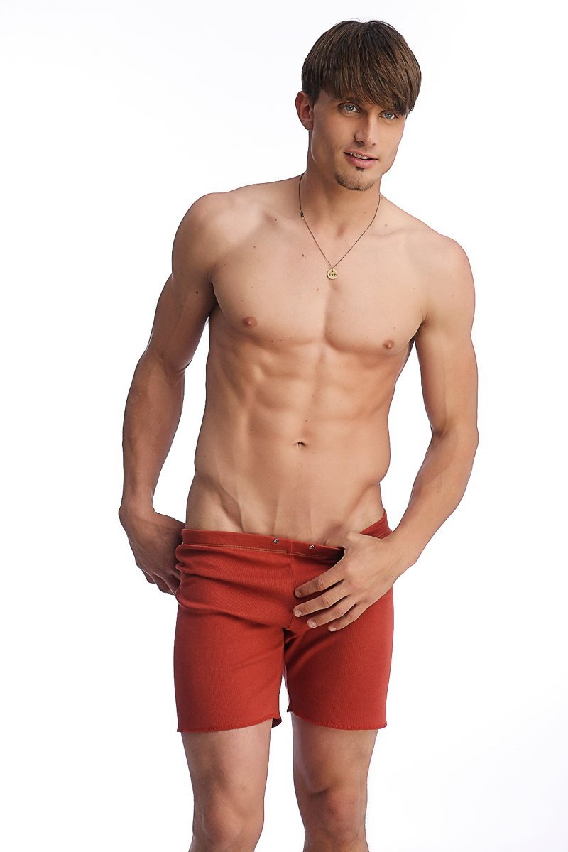 Fusion yoga short in cinnabar red featuring a snug fit with visible belt loops for athletic use