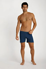 Navy blue fusion yoga short swim trunks with simple design and button closure at the waist for comfortable wear