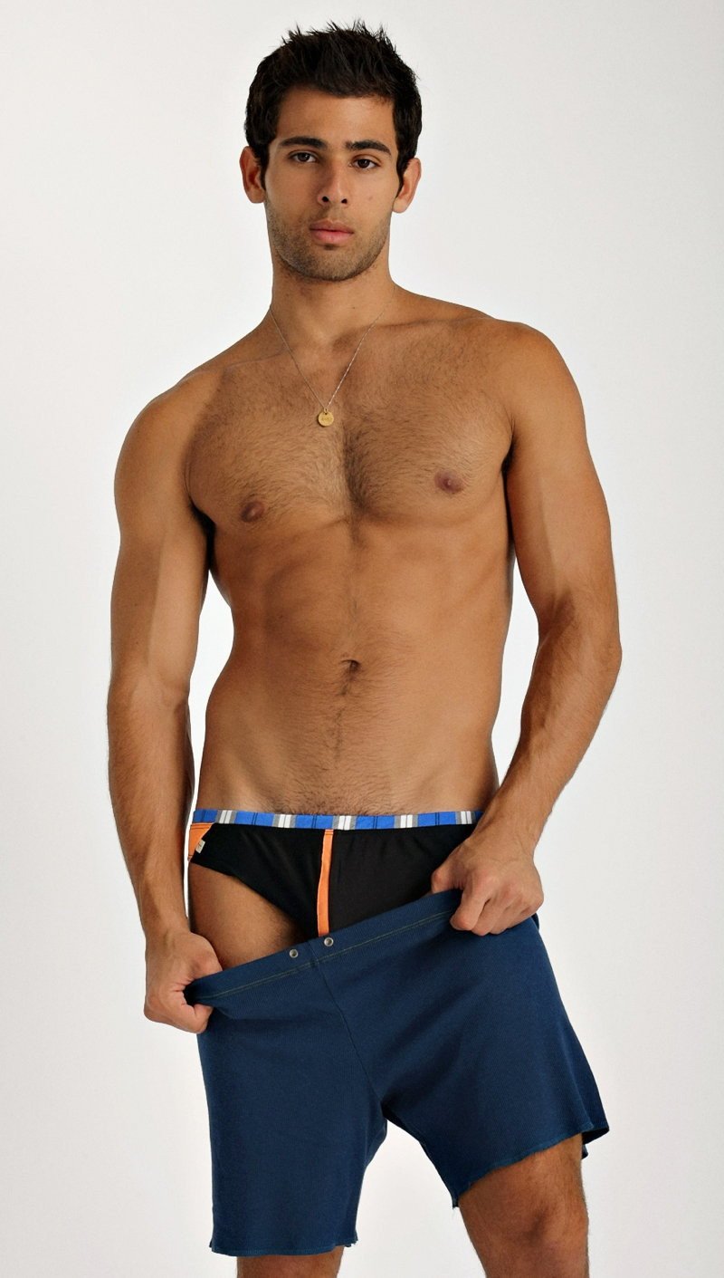 Navy blue fusion yoga shorts with striped waistband and orange side accents designed for athletic use