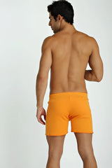 Bright orange fusion yoga shorts with smooth fitted fabric designed for flexible movement and comfort