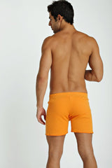 Bright orange fusion yoga shorts with smooth fitted fabric designed for flexible movement and comfort