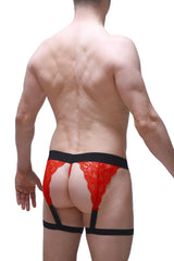 Red lace g-string Lurris lace red with black elastic waistband and leg straps shown from the back side