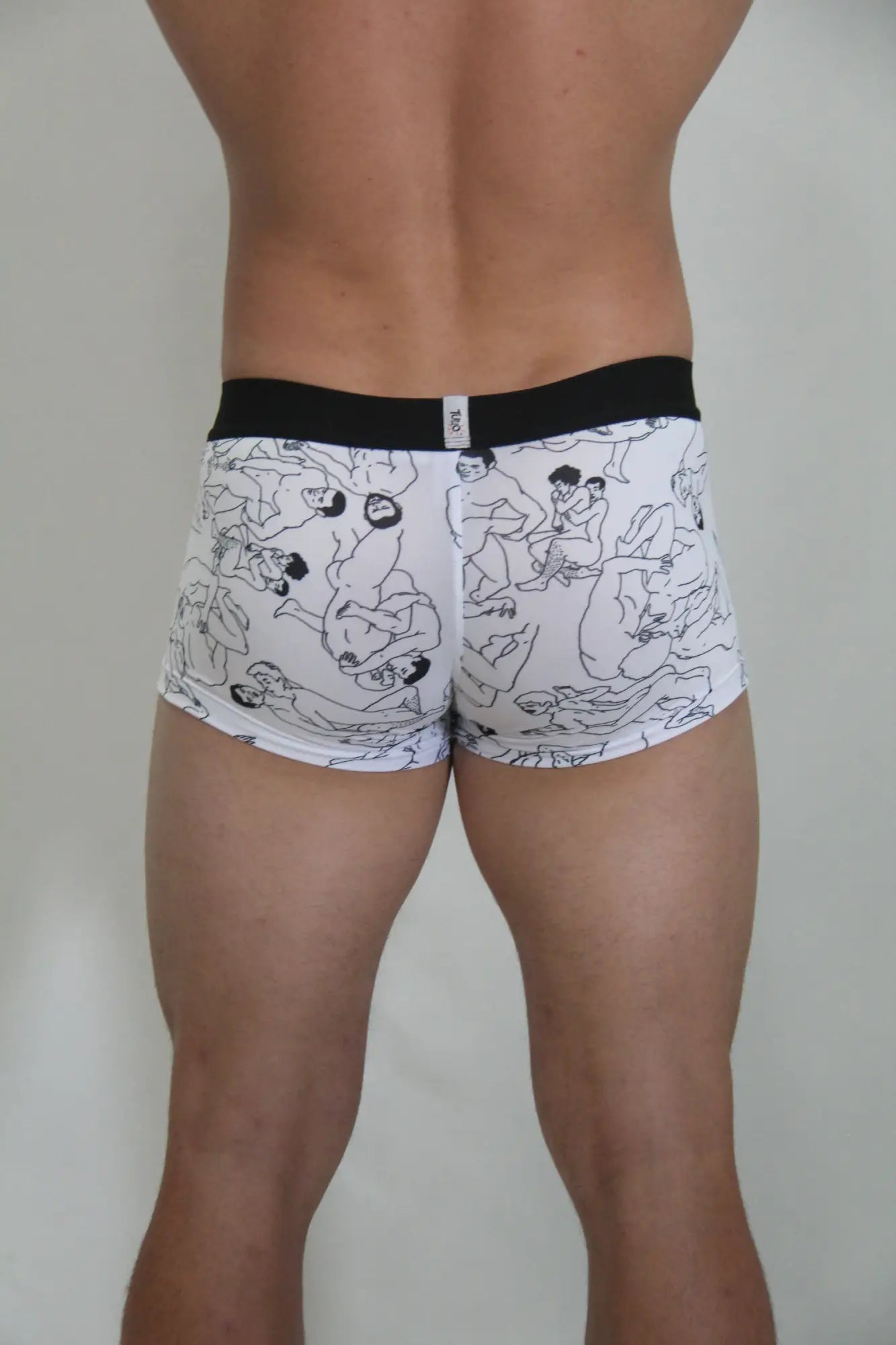White boxer briefs gay karmasutra trunk with black figure line drawings and solid black waistband front view