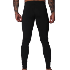 Back view of Gigo black, high-waisted, form-fitting Lycra leggings with a seamless, athletic design.
