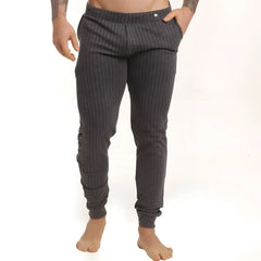 Dark gray pinstripe joggers with elastic cuffs and a subtle button at the waistband from gigo casual sportpants