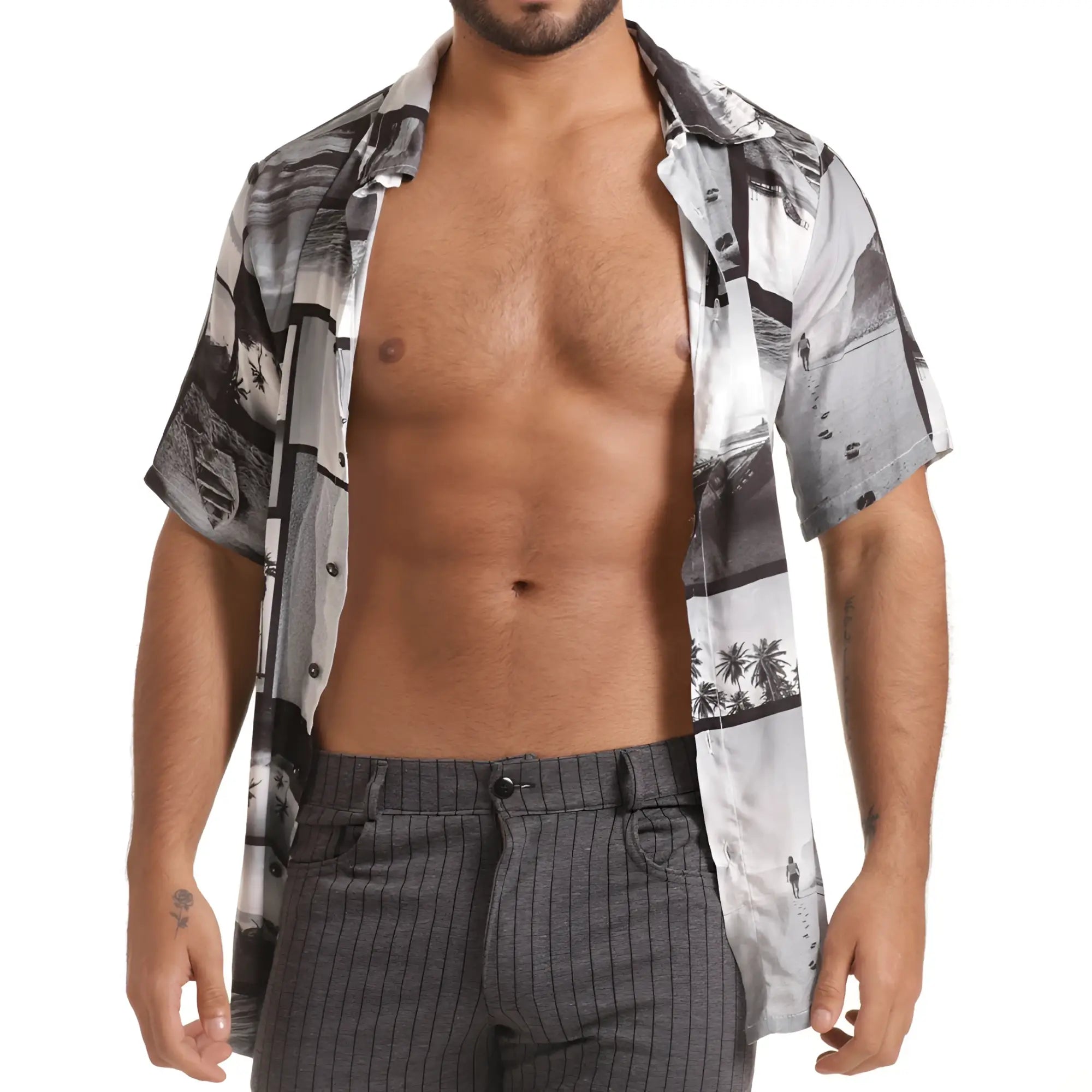 A man wearing a gigo charles shirt short-sleeved button-up with black and white coastal palm tree print
