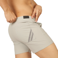 Beige gigo club gray athletic shorts back side with reflective diagonal stripes and black brand patch at waistband