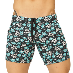 Black swim trunks from gigo comics beachwear with teal and white cartoon monsters featuring goo on chests