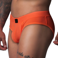 Bright orange textured mesh athletic brief with a wide waistband and a small black rectangular logo patch in front.