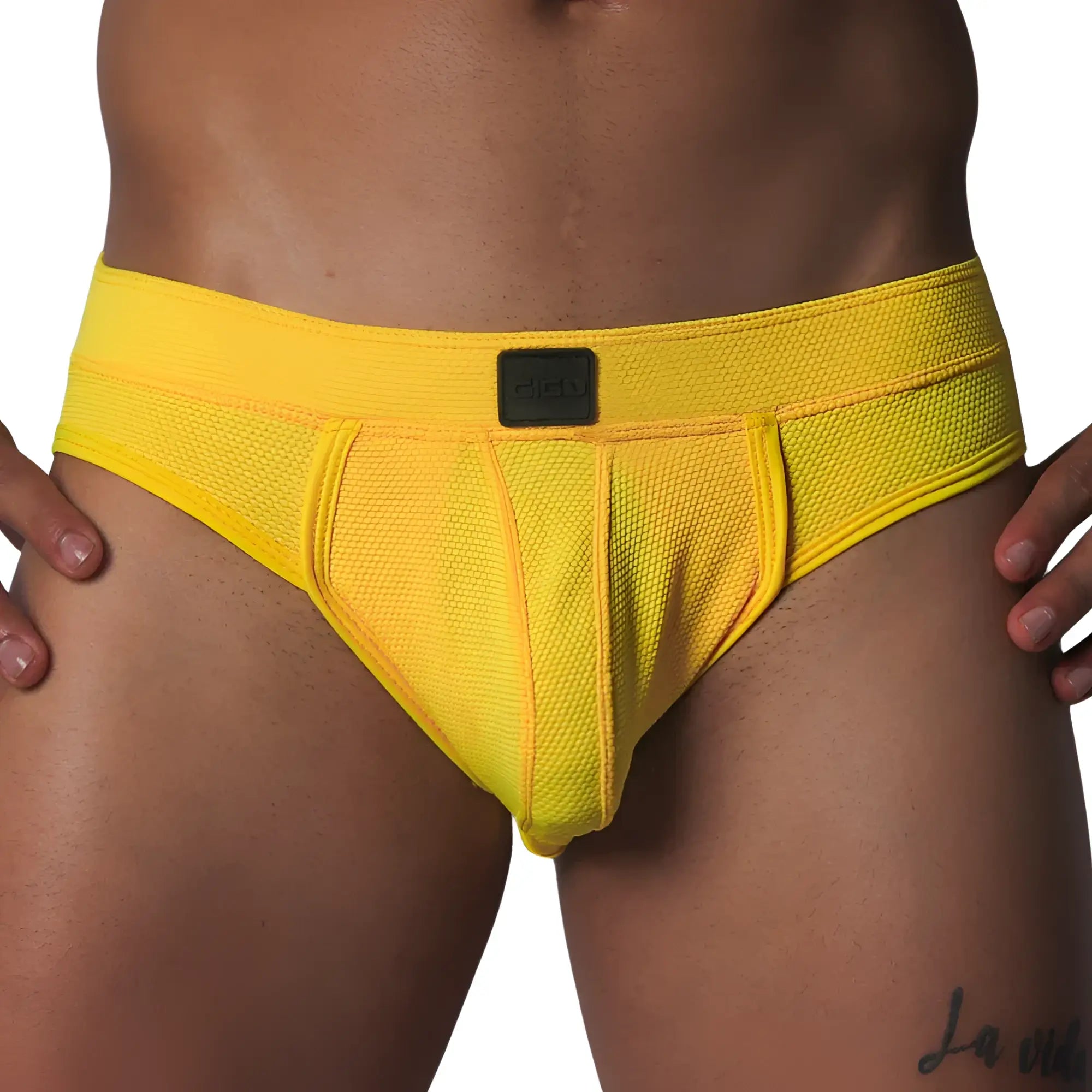 Bright yellow athletic mesh jockstrap with a wide waistband and a center black Gigo logo patch.