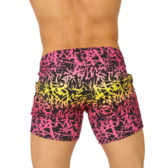 Vibrant gigo crazy beachwear shorts with bold pink and yellow graffiti pattern on black fabric for casual wear