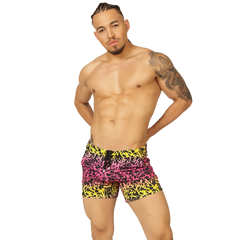 Vibrant graffiti-patterned swim trunks in bold pink yellow and black from Gigo Crazy Beachwear for beachwear use