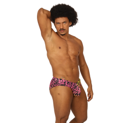 Gigo Crazy Swimbrief swim trunks in vibrant pink and black graffiti pattern with a yellow side accent for swimming
