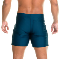 Dark teal gigo energetic green short swim trunks with sleek form fitting design and subtle seam detail on back side