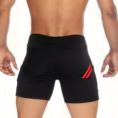Back side of gigo energy black athletic shorts featuring red diagonal stripes on the back pocket