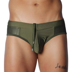Olive green swim brief with a center drawstring, contoured pouch, and textured side mesh panels.