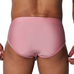 Solid pink athletic swim briefs featuring a classic brief cut with stitched panels and a supportive waistband.