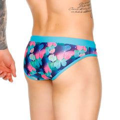 Vibrant blue and pink butterfly patterned gigo flowers swim brief with solid teal waistband for swimming and beachwear