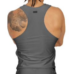 Back view of gigo glow gray tank made of gray ribbed fabric with a small black tag at the neck
