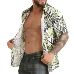 A man wearing a gigo jungle shirt short-sleeved button-up with green white and black leaf pattern