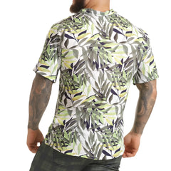 A menâ€™s short-sleeved button-up gigo jungle shirt with vibrant green gray and navy tropical leaf pattern on white background