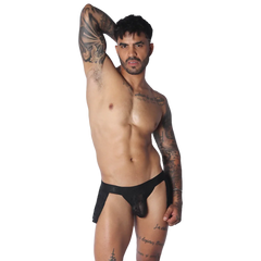 Black Gigo plush mini skirt with a fitted waistband and sheer side panels, worn by a tattooed man.