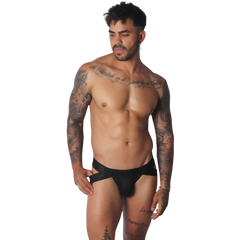 Black Gigo jockstrap featuring a wide branded elastic waistband and cutout side details on a tattooed male model.