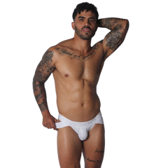 White jockstrap with textured pouch, branded elastic waistband, and side strap detailing.
